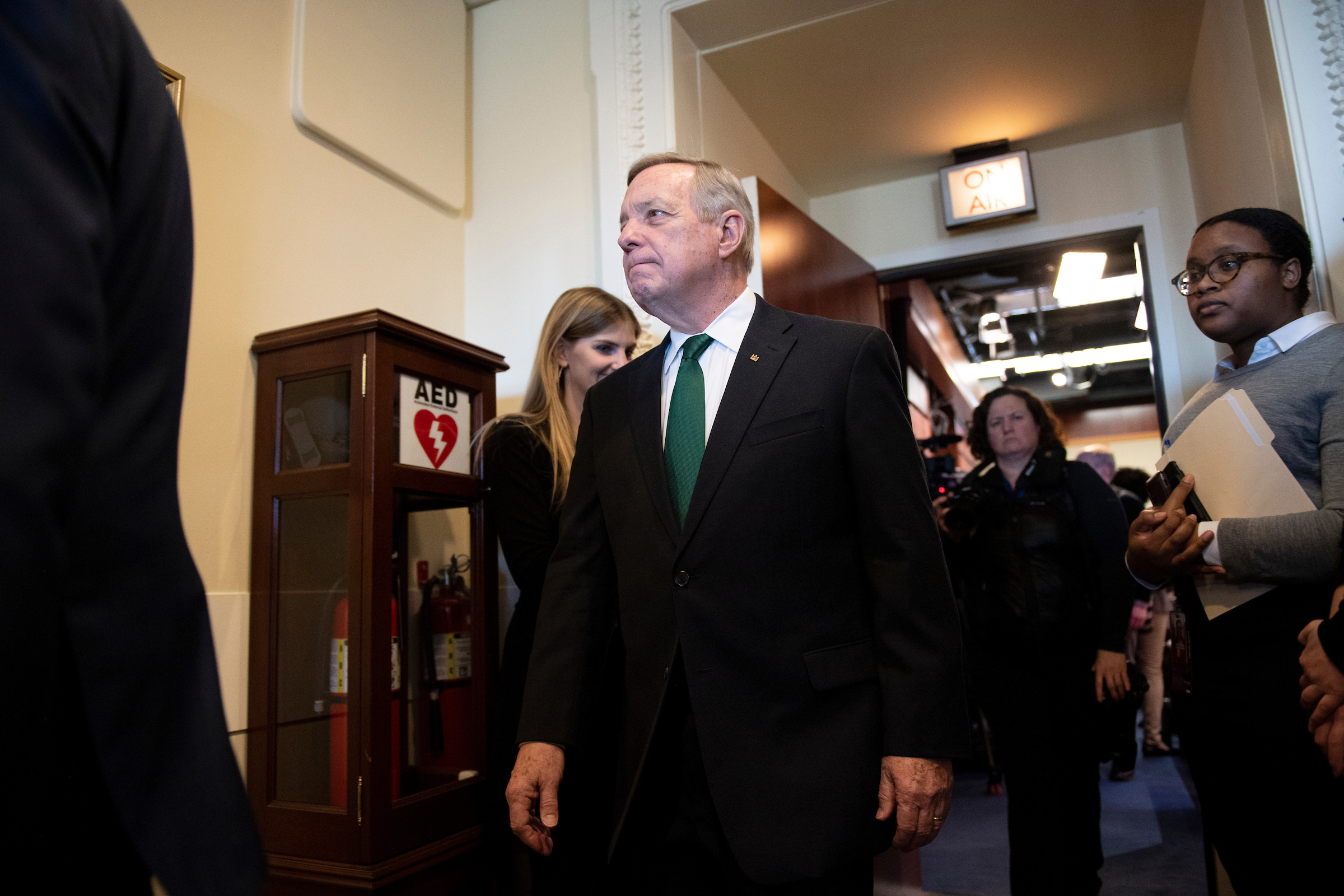 Sen. Richard Durbin, D-Ill., departs from a news conference Tuesday. On Monday Durbin and other Democrats held a press conference to advocate for the NO BAN Act. (Caroline Brehman/CQ Roll Call)