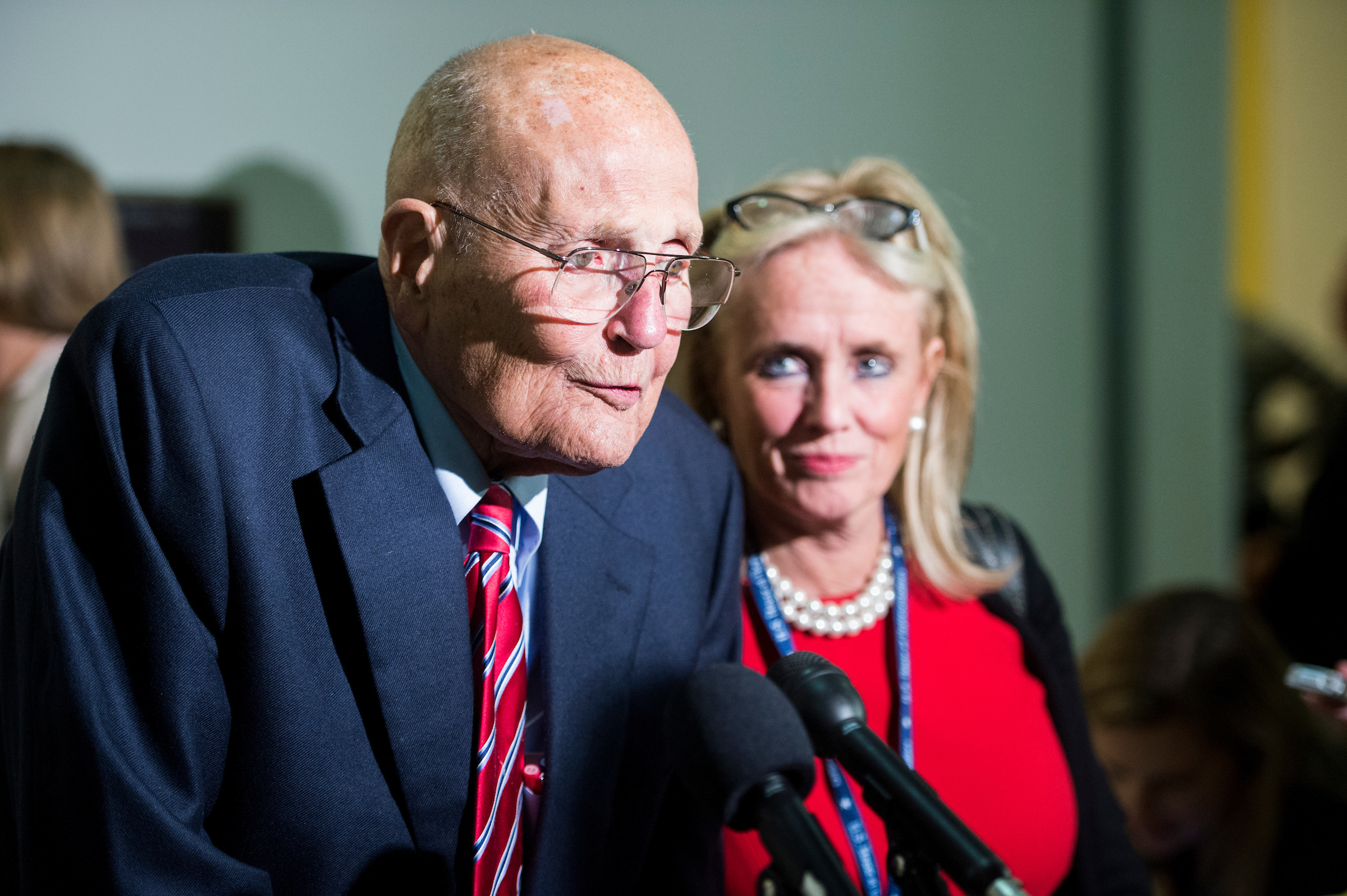 UNITED STATES - NOVEMBER12: Rep. John Dingell, D-Mich., and his wife Rep.-elect Debbie Dingell, D-Mich., speak with reporters as they arrive for the 114th Congress Member Reception in the Cannon House Office Building on Wednesday, Nov. 12, 2014. (Photo By Bill Clark/CQ Roll Call)