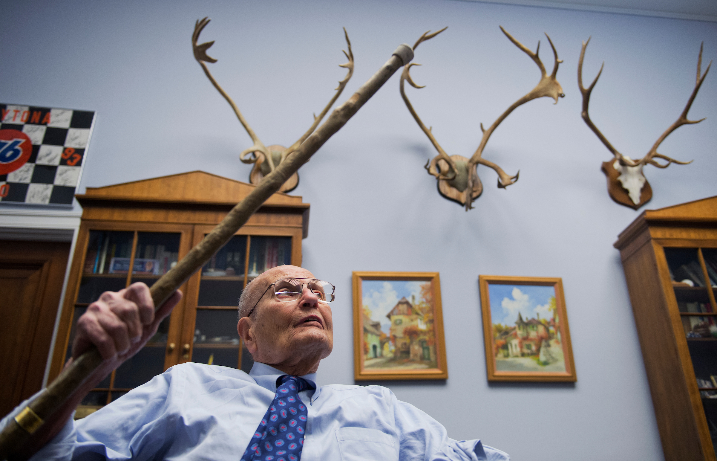 UNITED STATES - FEBRUARY 26: Rep. John Dingell, D-Mich., talks about memorabilia in his Rayburn office. (Photo By Tom Williams/CQ Roll Call)