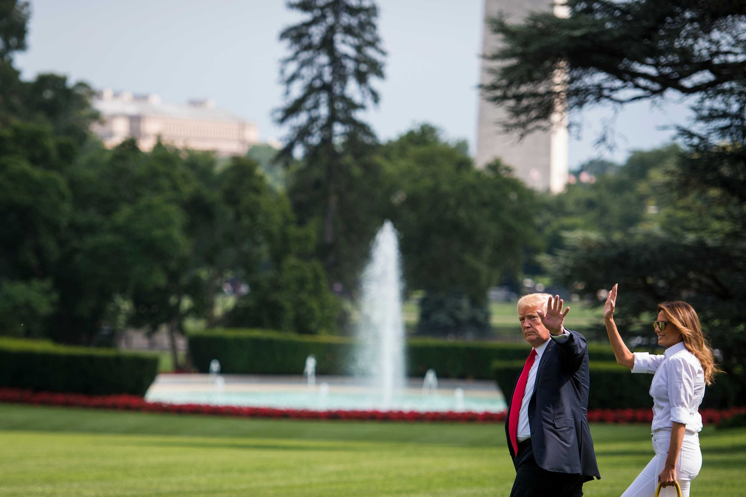 President Donald Trump and First Lady Melania Trump walk across the South Lawn to Marine One on their way to Joint Base Andrews Friday, July 27, 2018. (Sarah Silbiger/CQ Roll Call file photo)